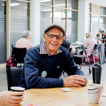 Older man attending an aged care event