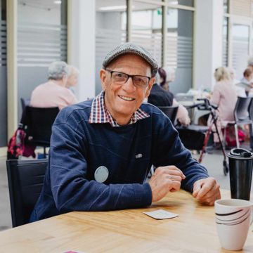 older man at a table