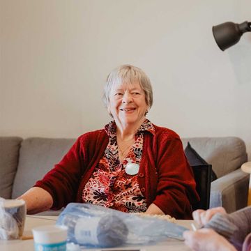 Older lady sitting on a couch