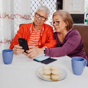 older couple looking at a smartphone