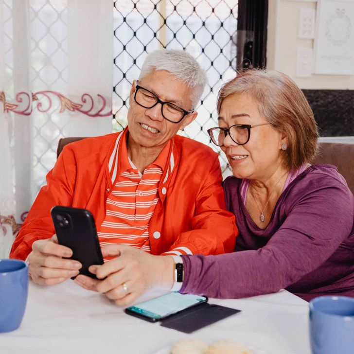older couple looking at a smartphone