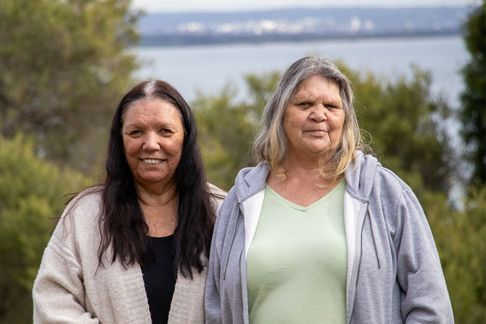 Two first nations women looking at the camera