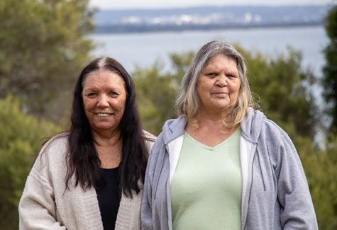 Two first nations women looking at the camera
