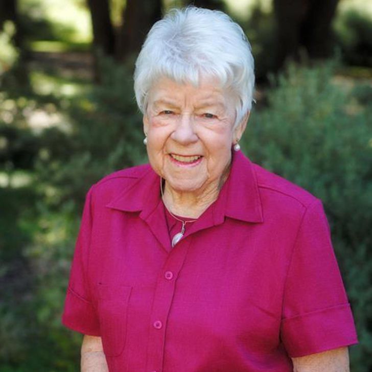 older woman in a pink shirt 