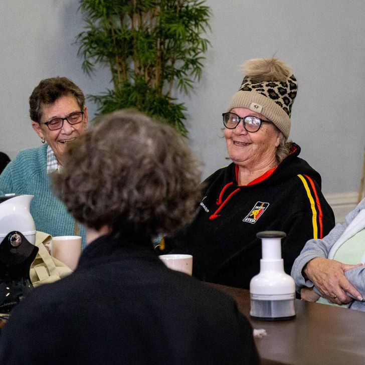A group of indigenous ladies discussing the LiveUp Mob Guide Toolkit