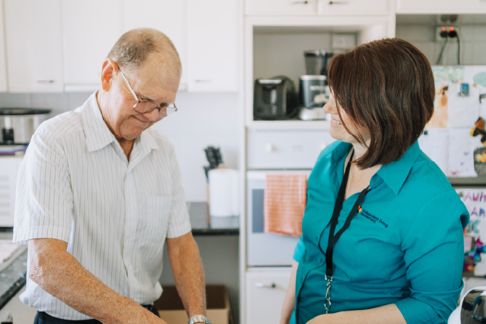 Aged care working interacting with a client