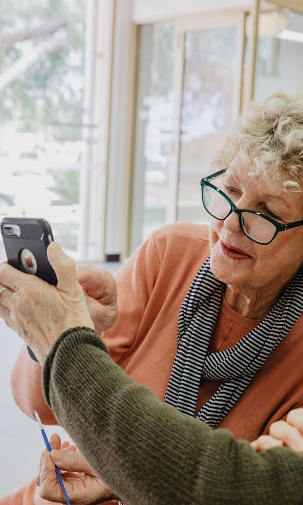 older woman using mobile phone app