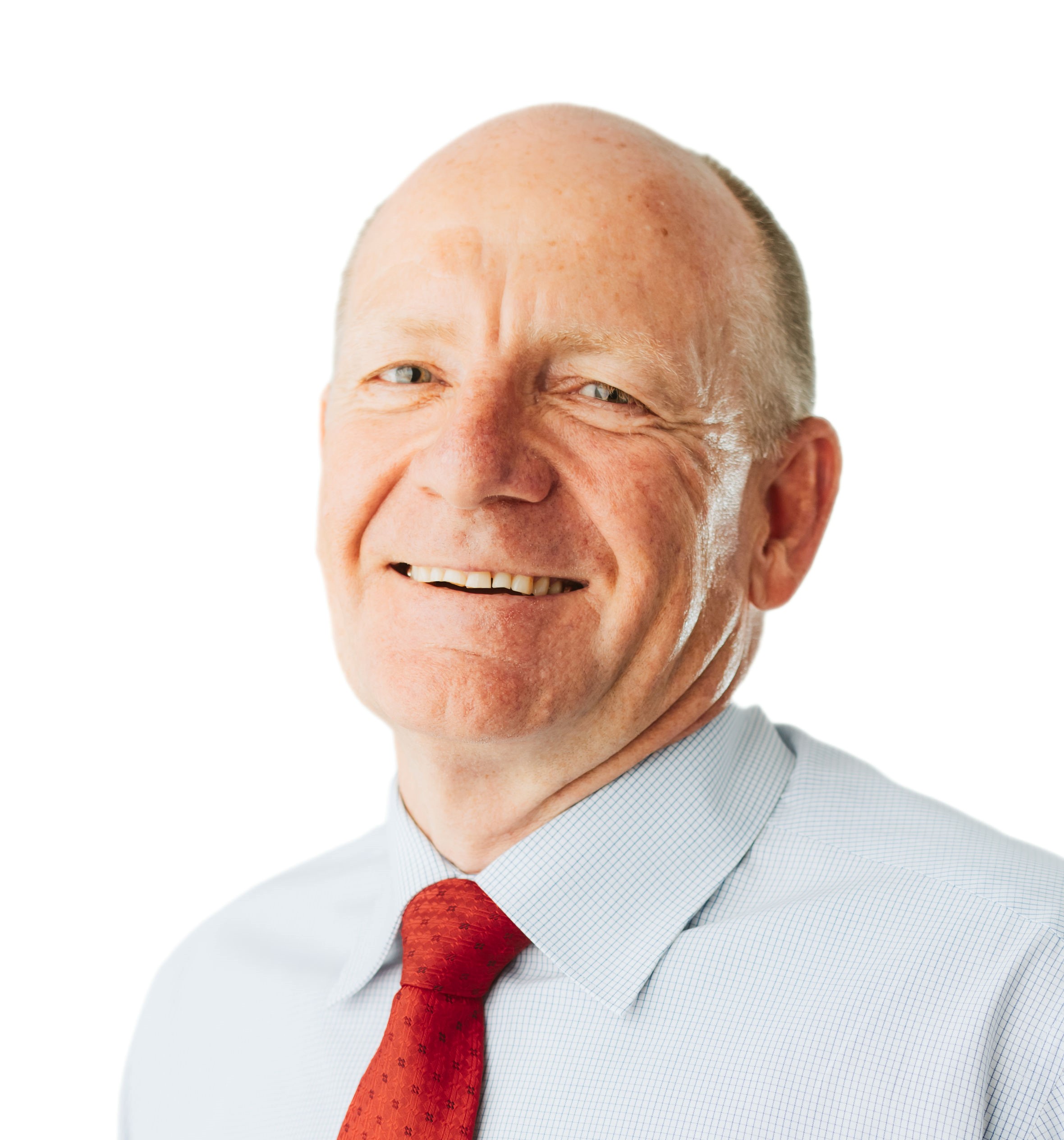 Ralph Gore Crop Smiling older professional man with shaved head, wearing white shirt and red tie