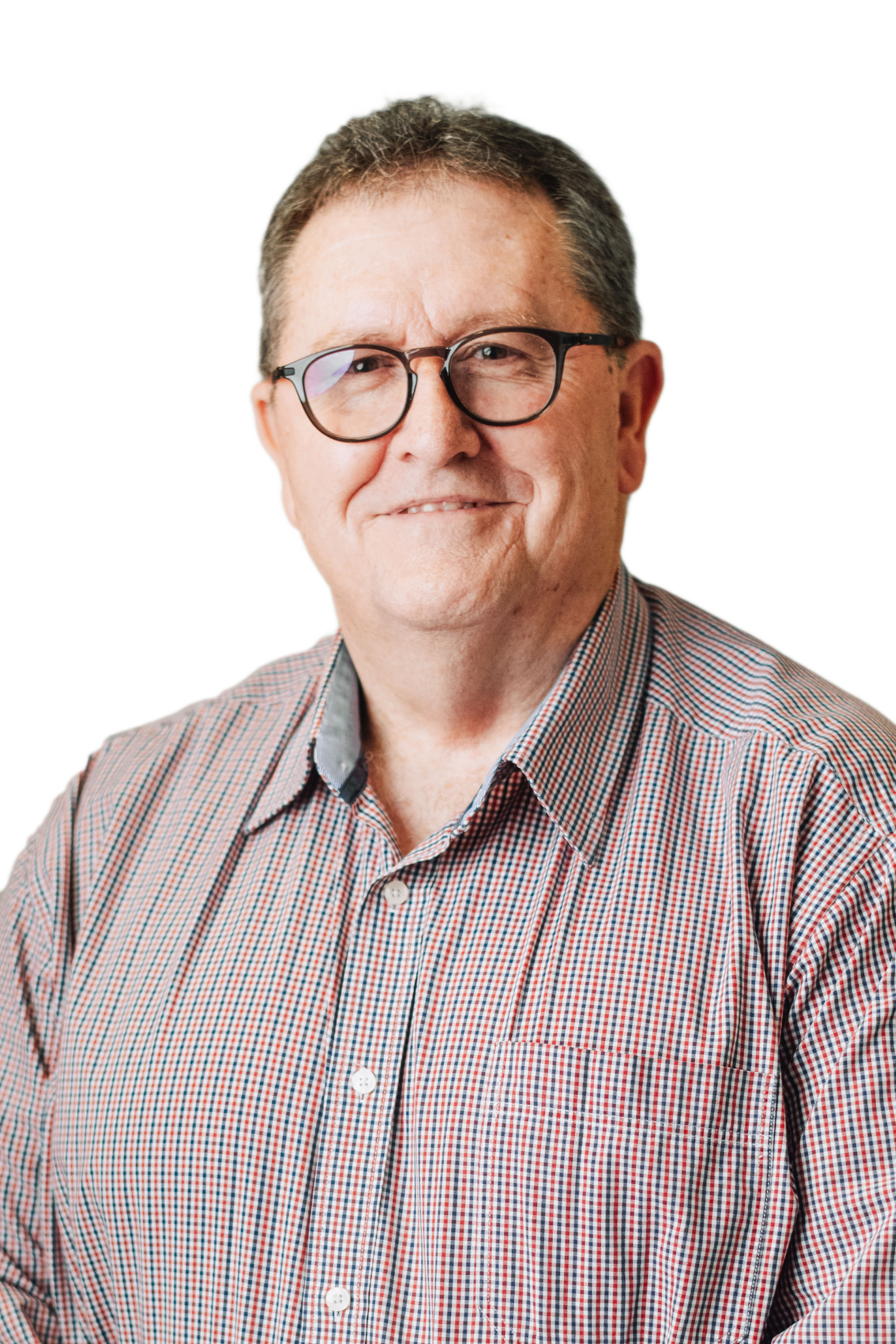 Wayne Belcher2 Older professional man with dark hair wearing glasses and dark blazer