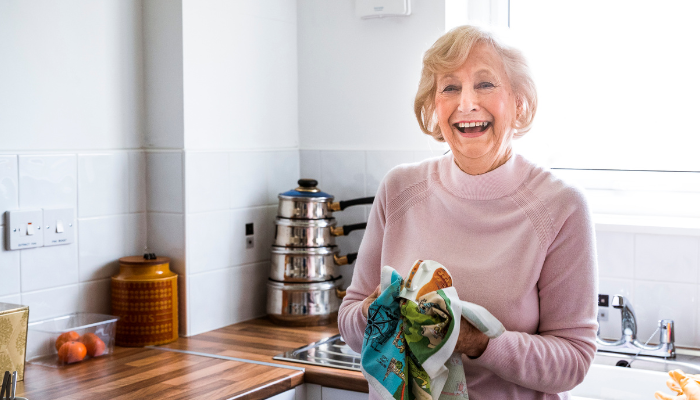 happy old lady in kitchen happy old lady in kitchen