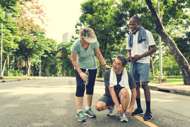 senior-people-jogging-park-happiness-concept-resize Three older people jogging in park